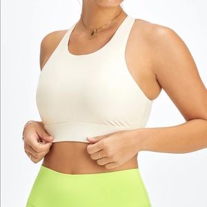 High impact light pink Fabletics sports bra